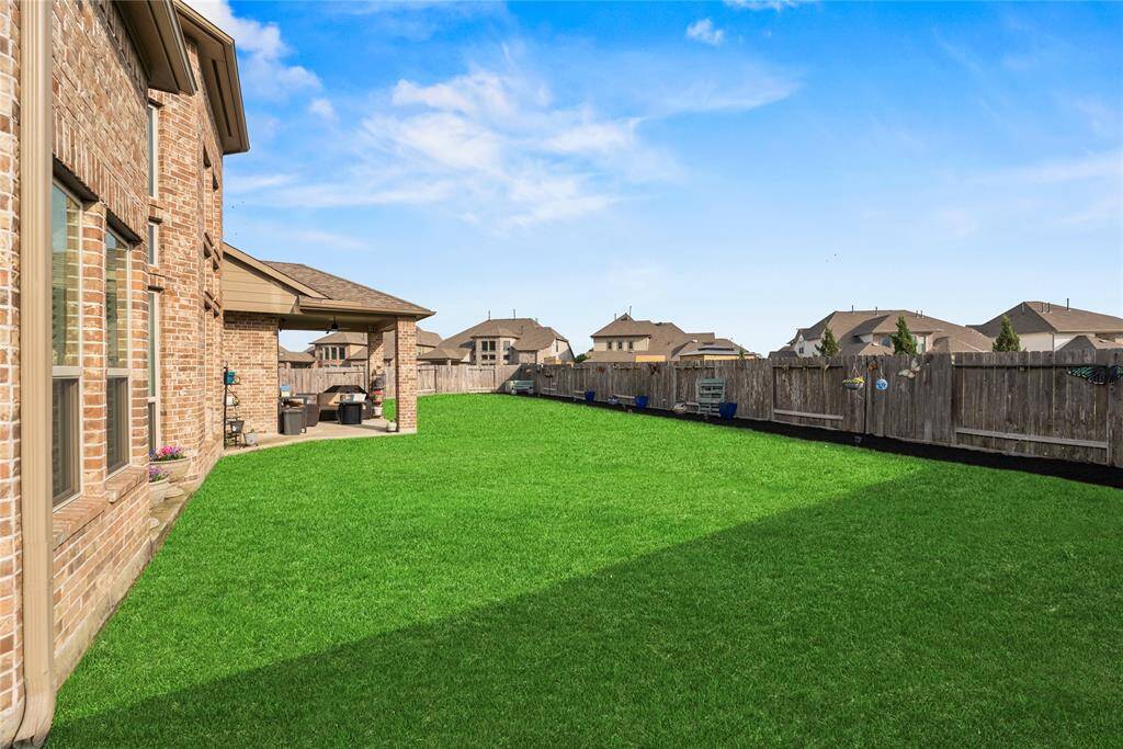 Huge backyard perfect for a pool or space to run around and entertain.