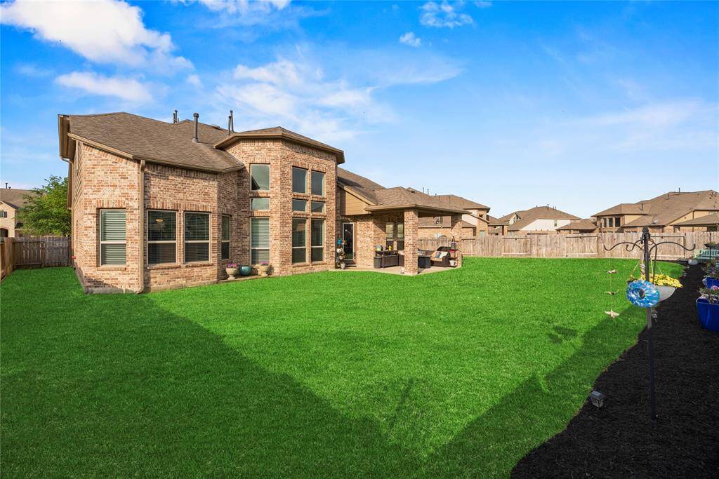 Another view of the back of the home and backyard.