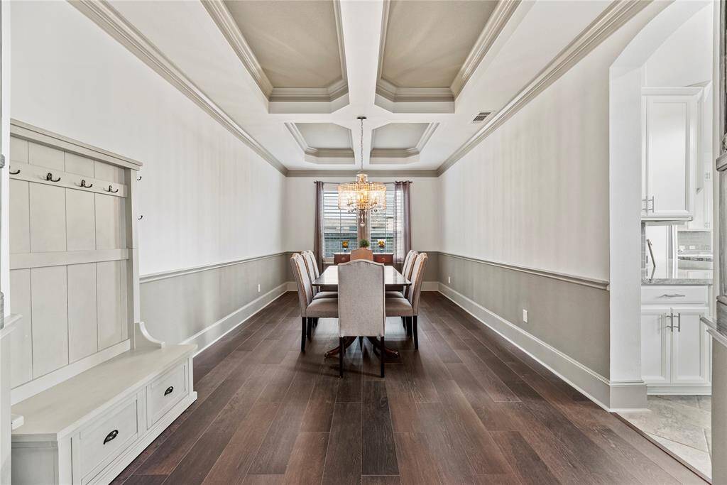 Formal Dining Room featuring designer lighting and beautiful architecture.