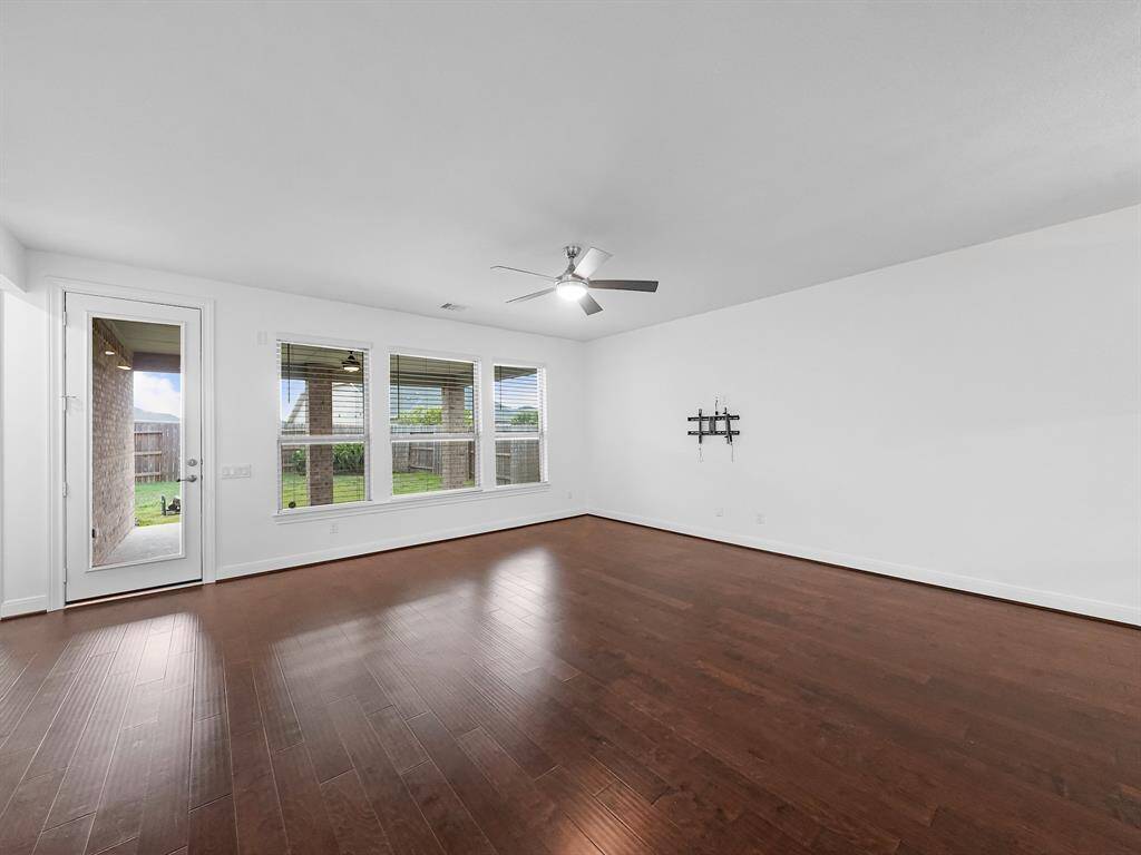 Spacious living area with views and access to the backyard.