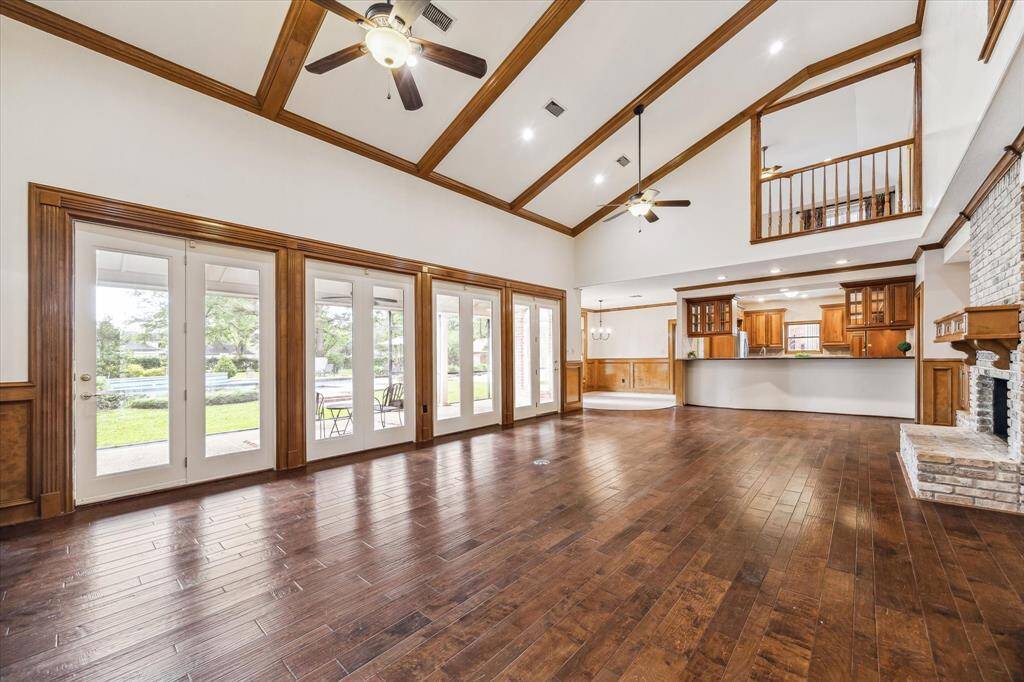 The family room brings in nightly sunsets through the wall of windows.