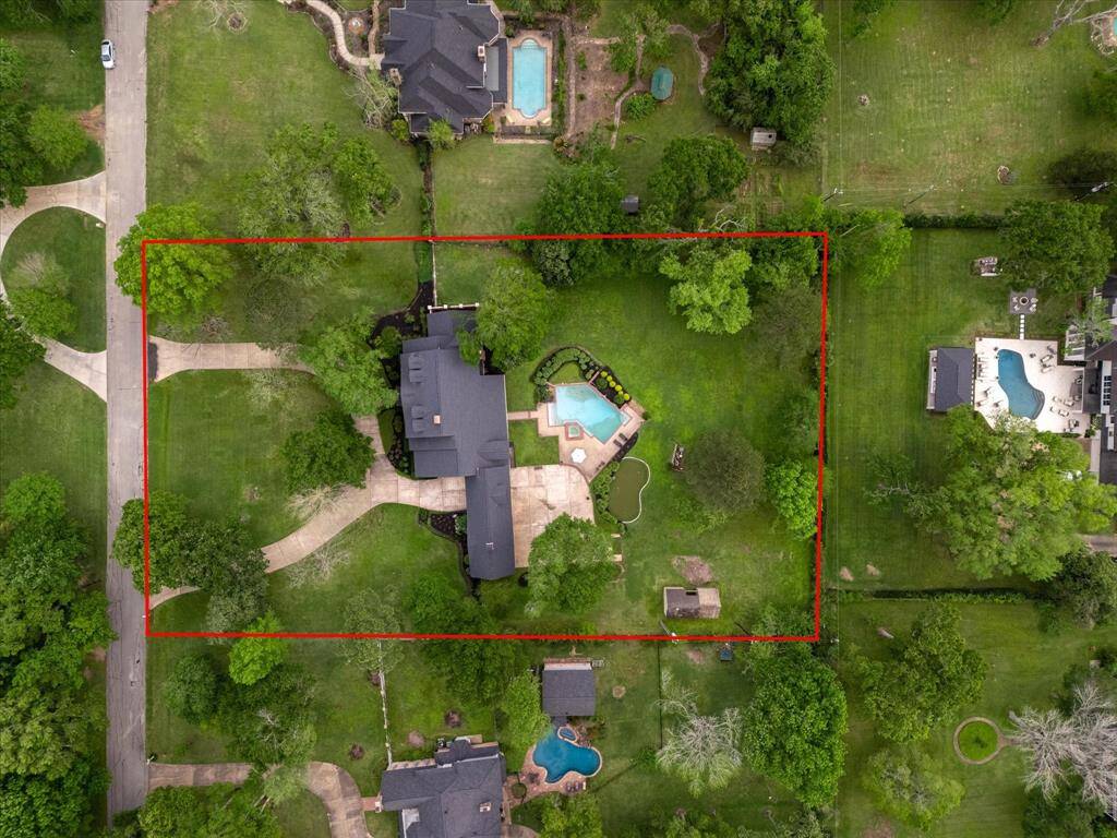 1.88 acres nestled among mature trees.