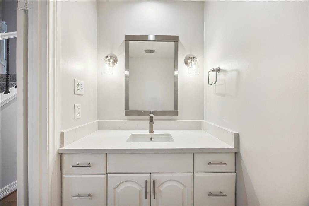 Stylish downstairs half bath.