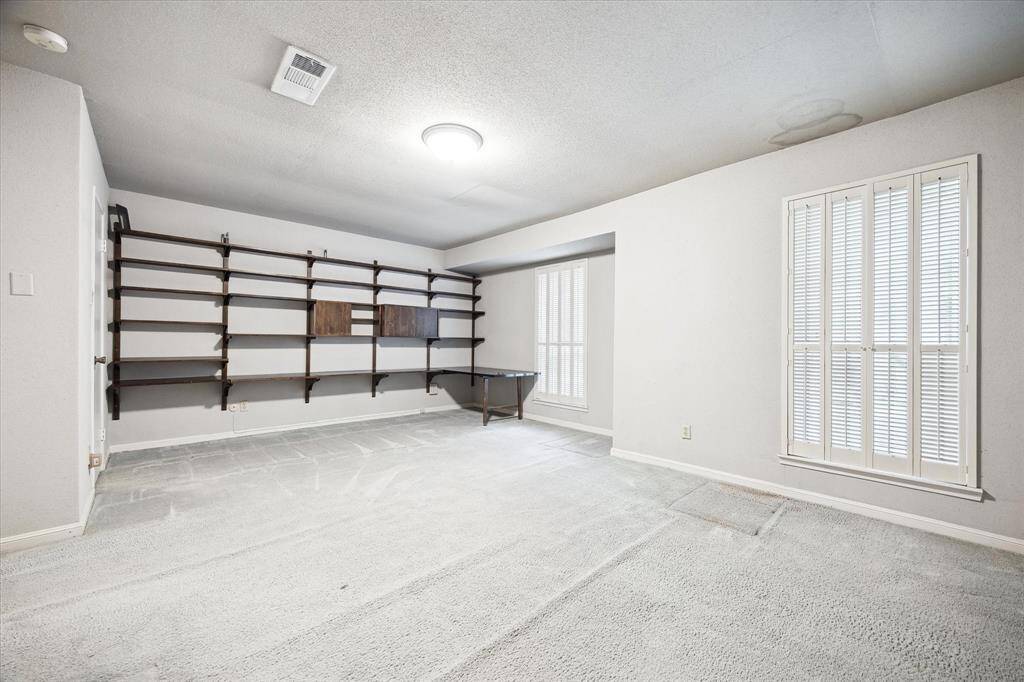 Secondary bedroom that is so large, you can make into two bedrooms. There are two closets on each side of the room.