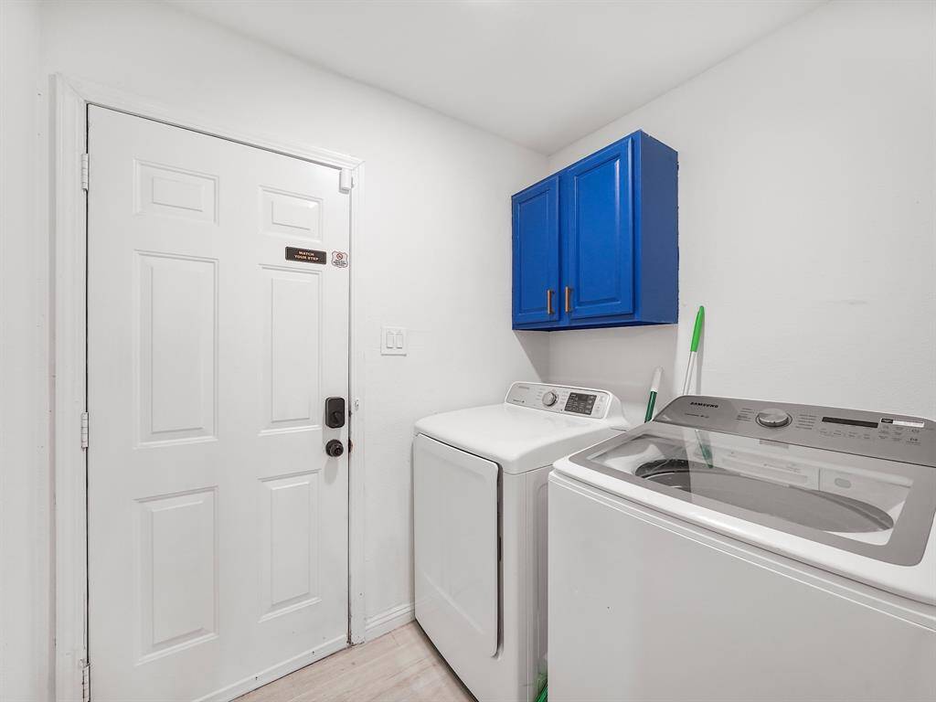 Utility room in home features cabinet for storage!