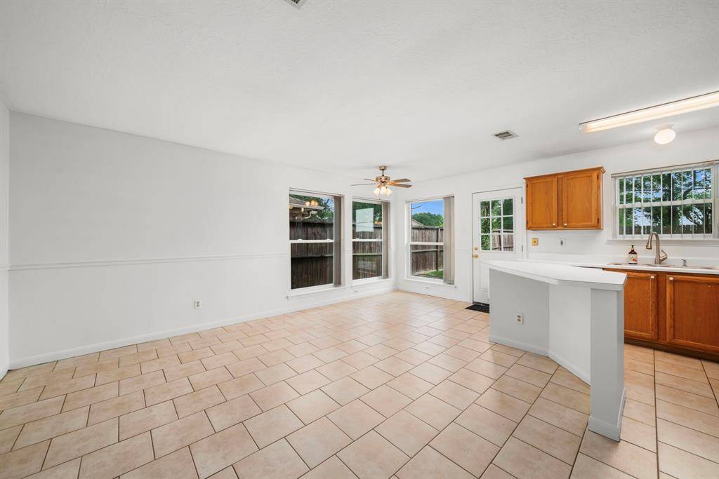 Alternate view of the kitchen. Keep the space as is, or if you choose to renovate you have plenty of room to expand.