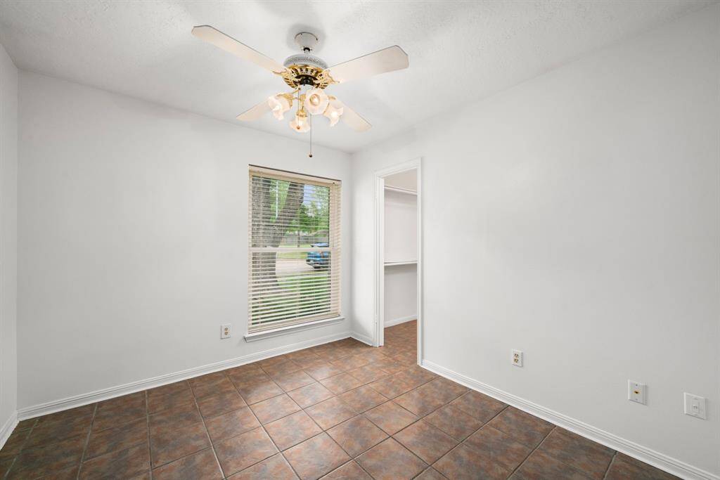 Front secondary bedroom with walk-in closet (approx 9.9 x 10').