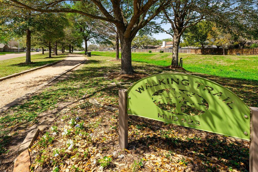 Community walking trail across the street from your home.