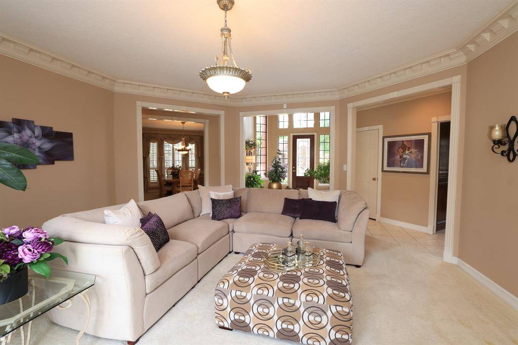 Formal Living area peers into the Entry and Dining Room