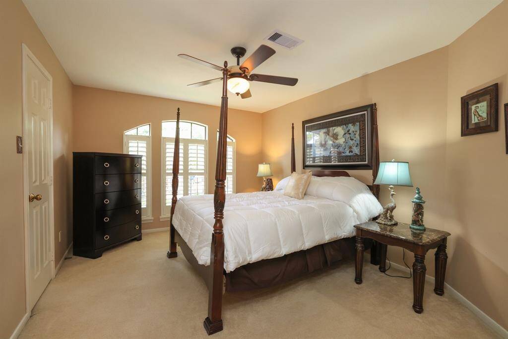 Secondary bedroom with full size bath just outside.  Plush carpeting and walk in closet