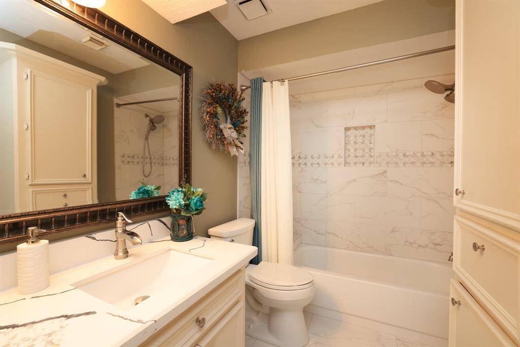 Full size upstairs bath has been remodeled with quart countertops, large mirror and tile flooring.  The tub/shower has new quartz lined walls and shower faucets!