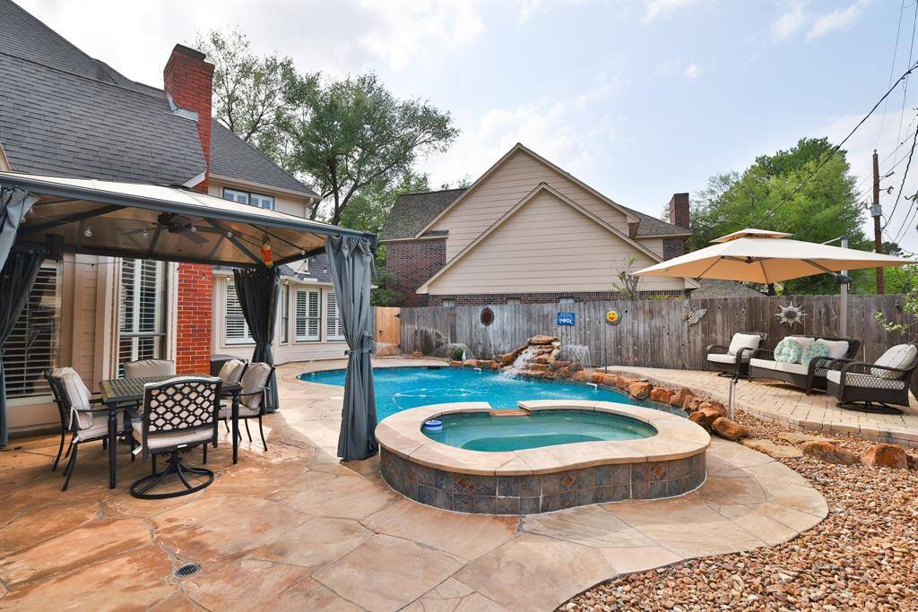 Relax in your private oasis with pool, spa and large flagstone patio.