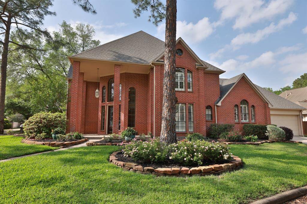 Two car garage is on the side of the home with double driveway.