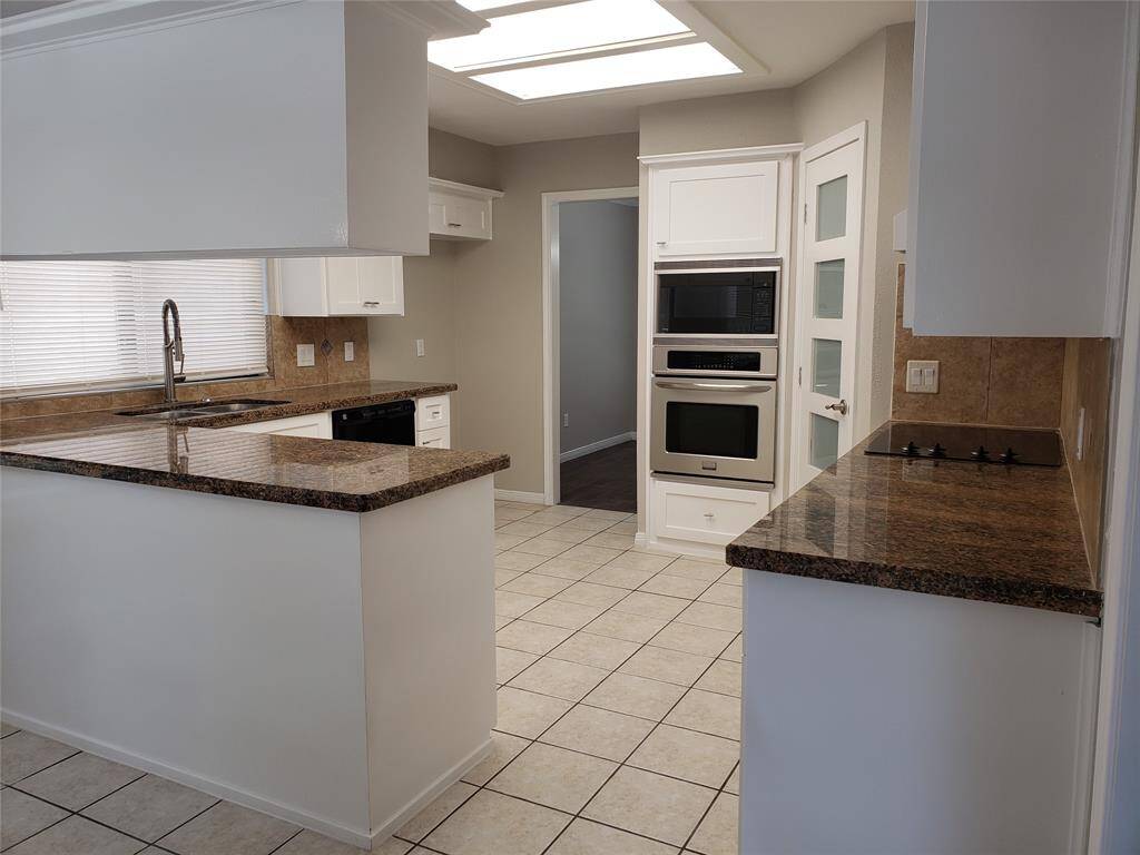 UPDATED KITCHEN WITH GRANITE COUNTER TOP AND NEW CABINET