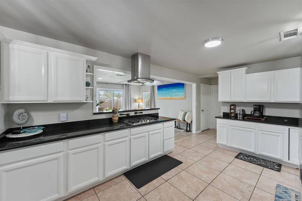 The open-concept design allows you to stay connected while cooking, with sightlines to the bonus living area and backyard beyond.