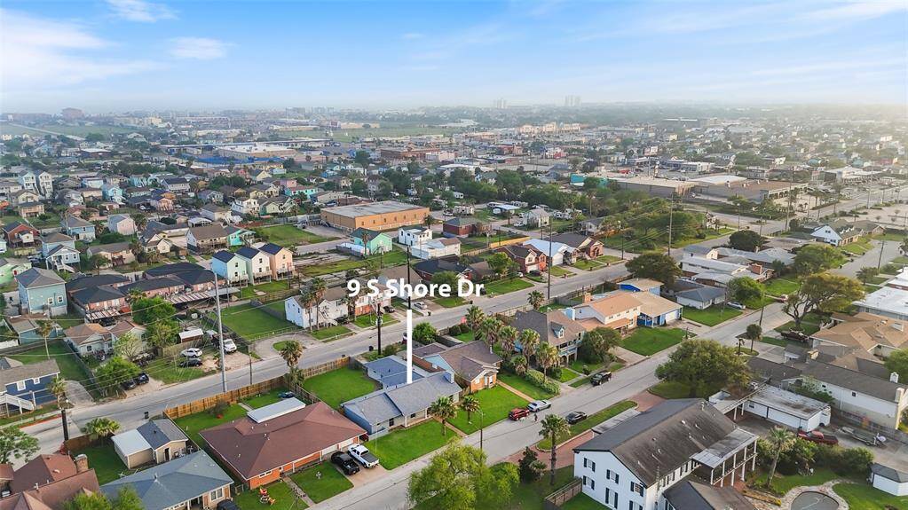 Aerial view pinpointing 9 S Shore Dr, showcasing its prime located in the heart of Galveston.