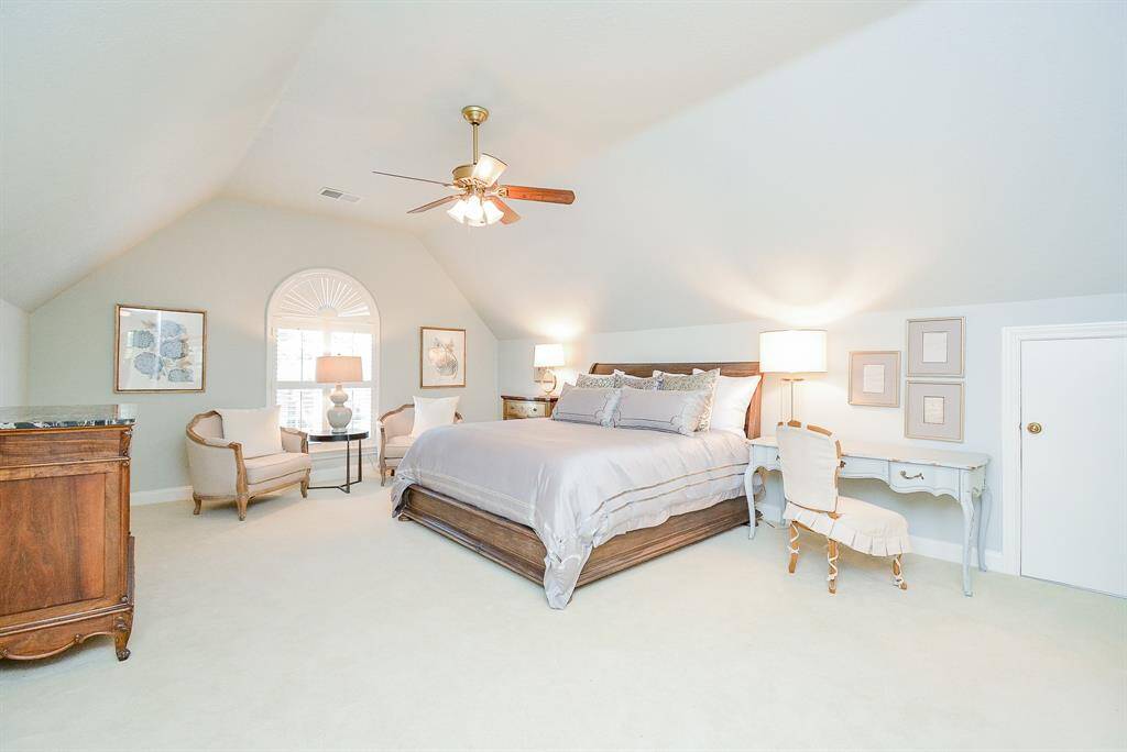 This spacious Game Room with lots of Natural light that pours in through the wide windows with Planation shutters.