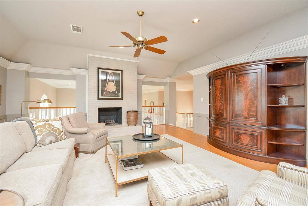 This room again features a neutral color palette overlooking the living room.