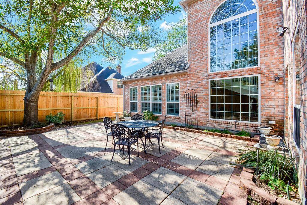 This aerial view showcases the spacious home nestled among mature trees with no rear neighbors with a pathway  to Hershey Park next to the home offering the home serenity and privacy.