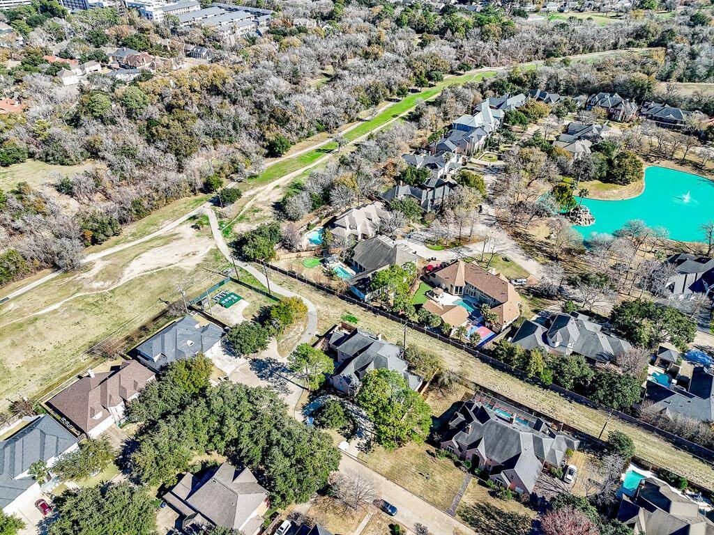 This photo showcases the park with walking paths. Ideal for heathy outdoor activities and relaxation, it's a great community feature for nearby homes.