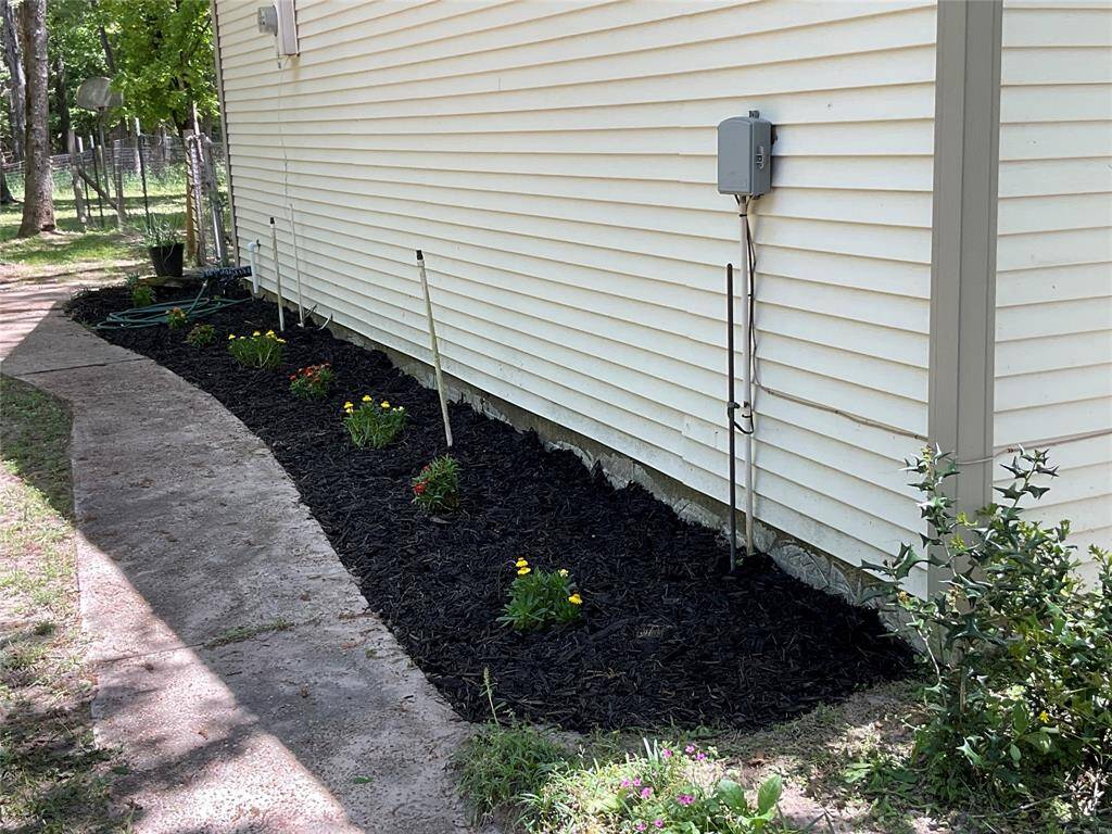 Fresh planted garden on the side of the house.