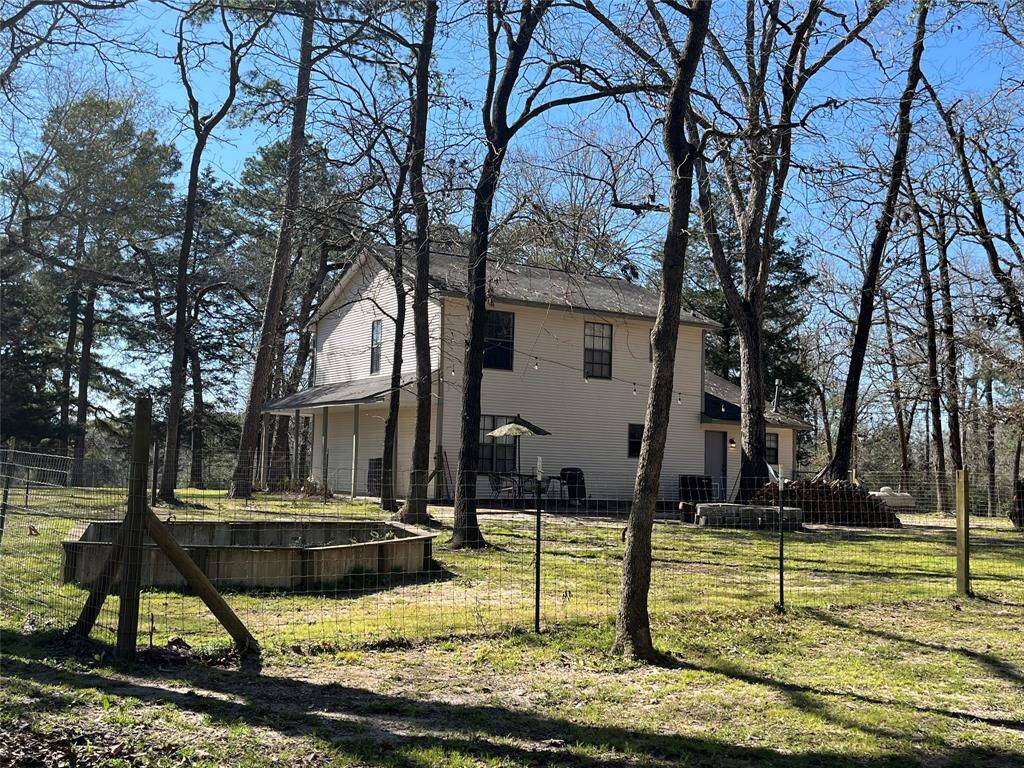 Back of the house showing the fenced in area.