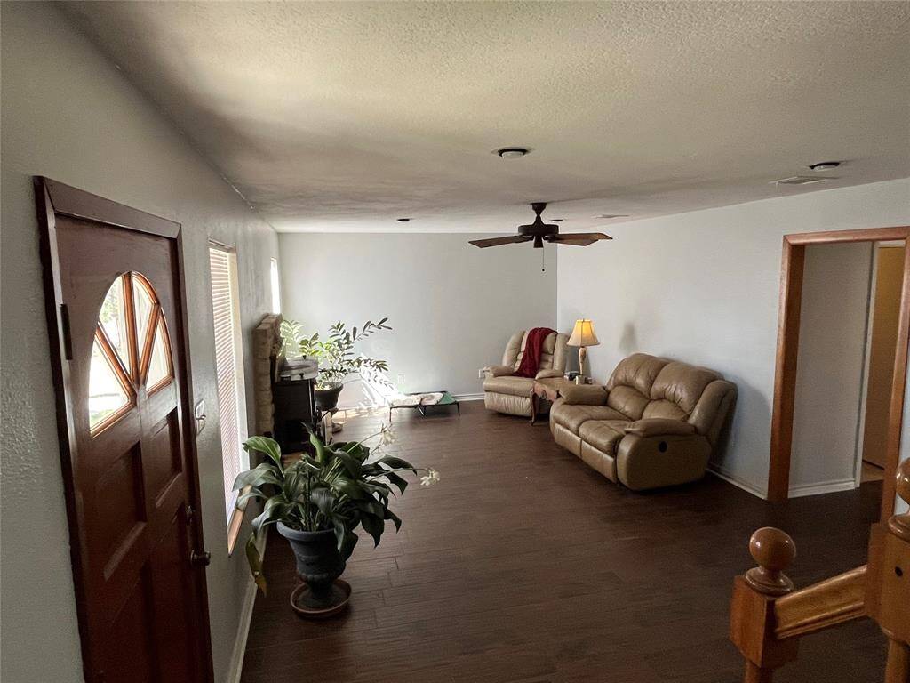 Just inside the front door is the spacious living room and doorway to the kitchen and dining room.