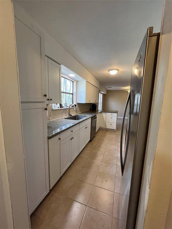 Lovely window over the sink and lots of cabinets.