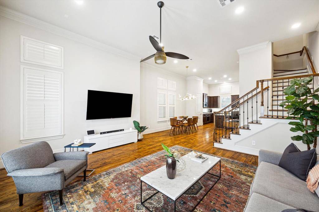 Another view of the living room with ample space for additional seating and entertaining