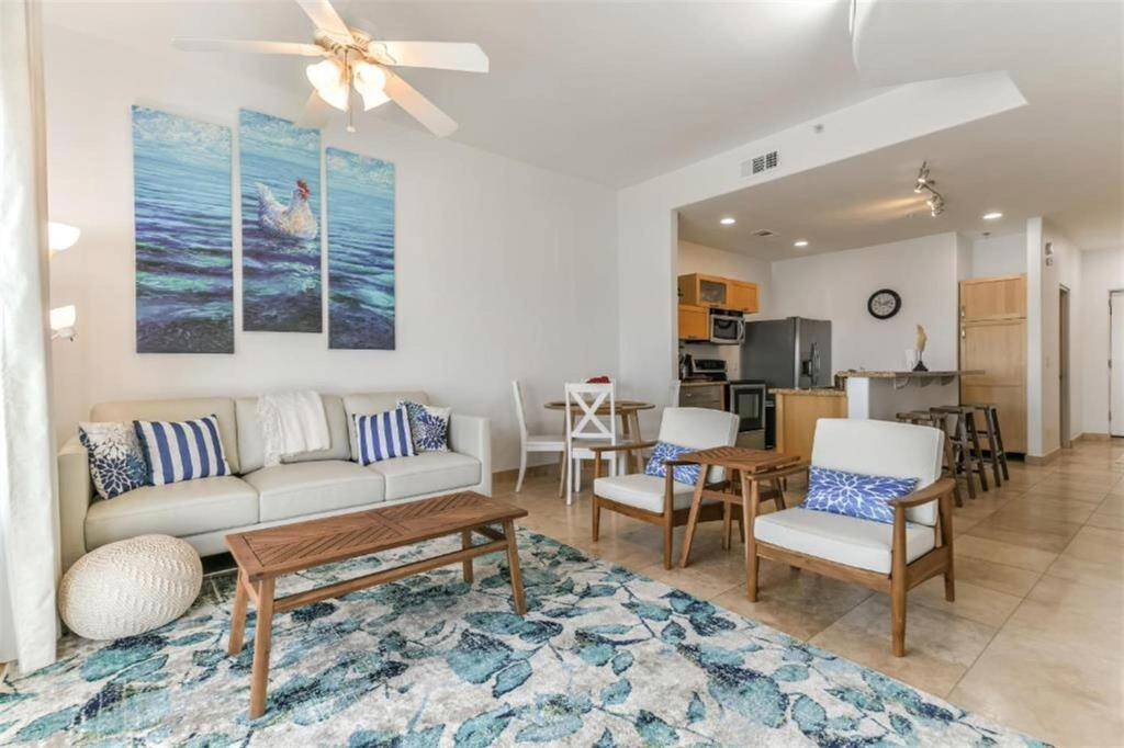 The open living room with seating for 5! This open plan allows for different layout combinations.