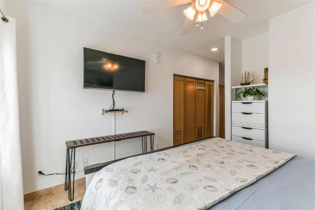 This room offers a spacious closet and extra built in storage.