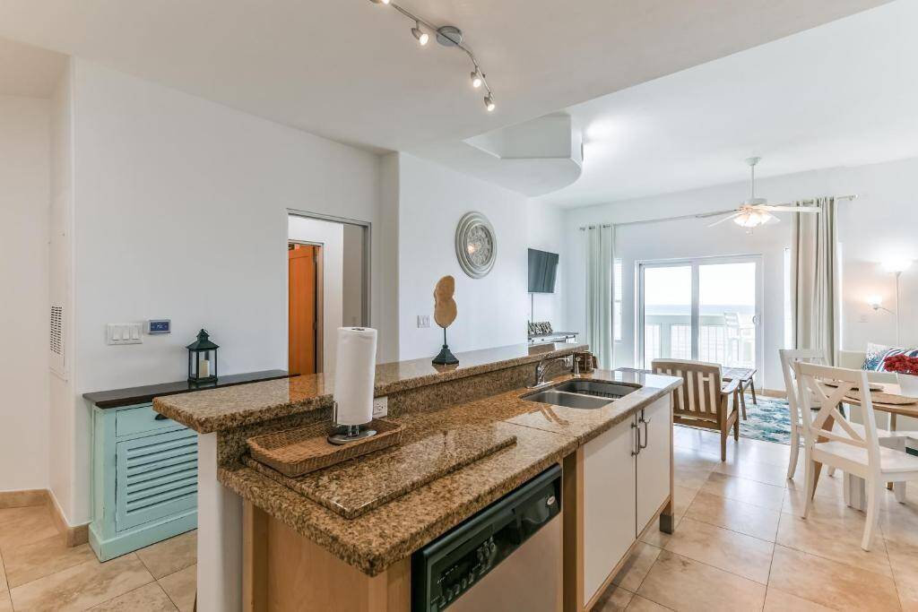 Another view of the kitchen. The door to the left takes you into the spacious primary with en-suit bathroom.