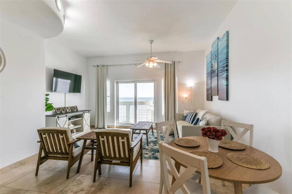 Just off of the kitchen you will come across the dining/ living room combo. Notice the Abundance of light in the room.