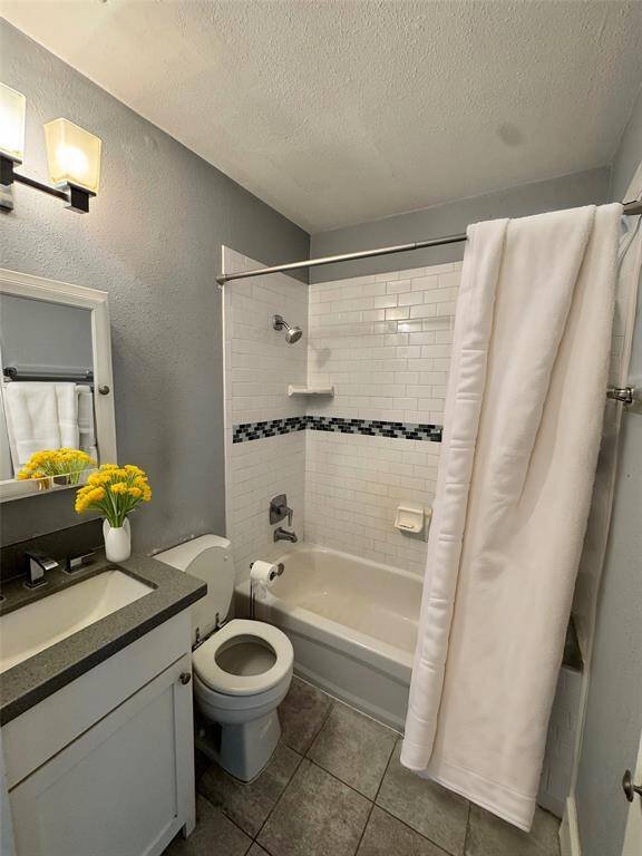 Bathroom has a tub/shower combination. AI Staged.