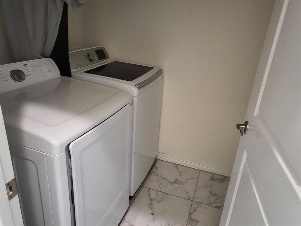 Laundry, inside, upfront by 2 front bedrooms.