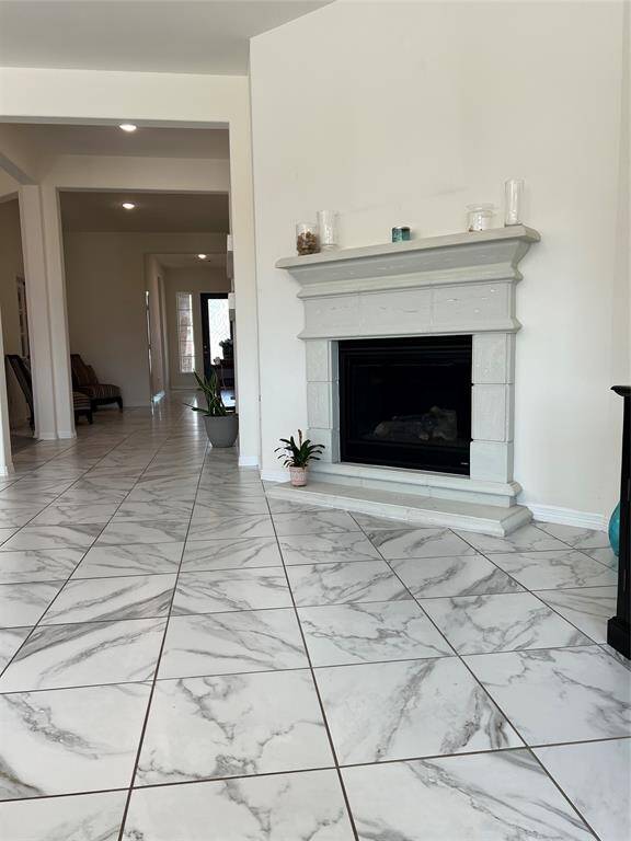Gas Log Fireplace in the living area, looking towards the front entry hall.