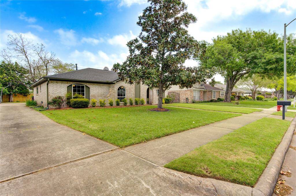 Mature landscaping and a lovely Magnolia tree in the front yard!