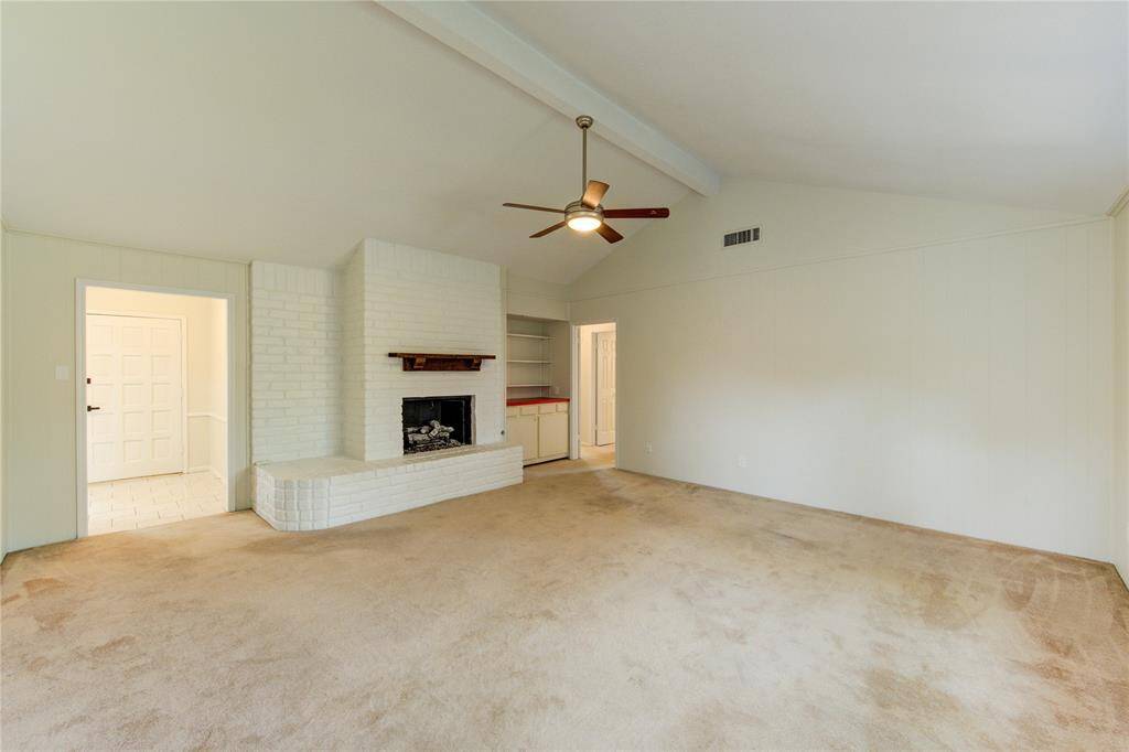 Family room with gas-log fireplace.