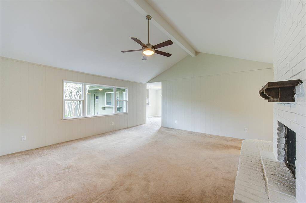 Family room with vaulted ceilings and a great view of the backyard!