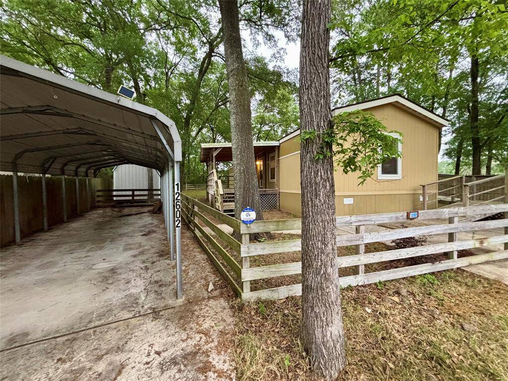 Oversized property with 2 huge storage buildings and extra long carport