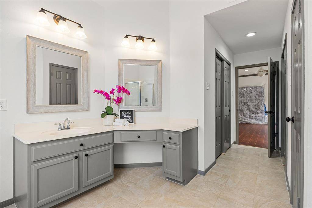 The primary bath is a relaxing retreat featuring separate vanities, a soaking tub, walk-in shower, makeup area, and a spacious walk-in closet.