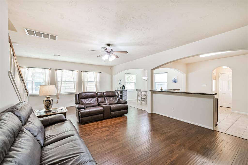 This view captures the large living area that is open to the kitchen and dining area.  This home is perfect for hosting and entertaining!!!