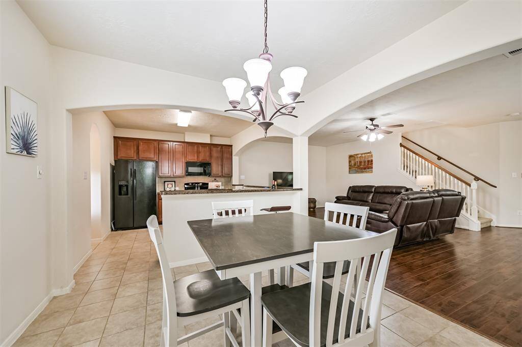 Spacious dining area with an open concept design, flowing into the kitchen for easy entertaining and everyday living.  Perfect for gathering and making memories!!
