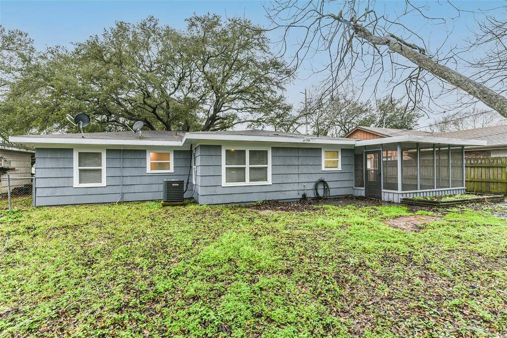 Fenced backyard has large screened in porch!