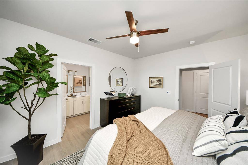 Spacious Owner’s retreat with wood-like floors, walk-in closet and spa-like bath w/dual sinks.