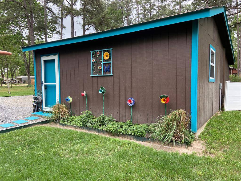 Convenient side garage entry with decorative landscaping