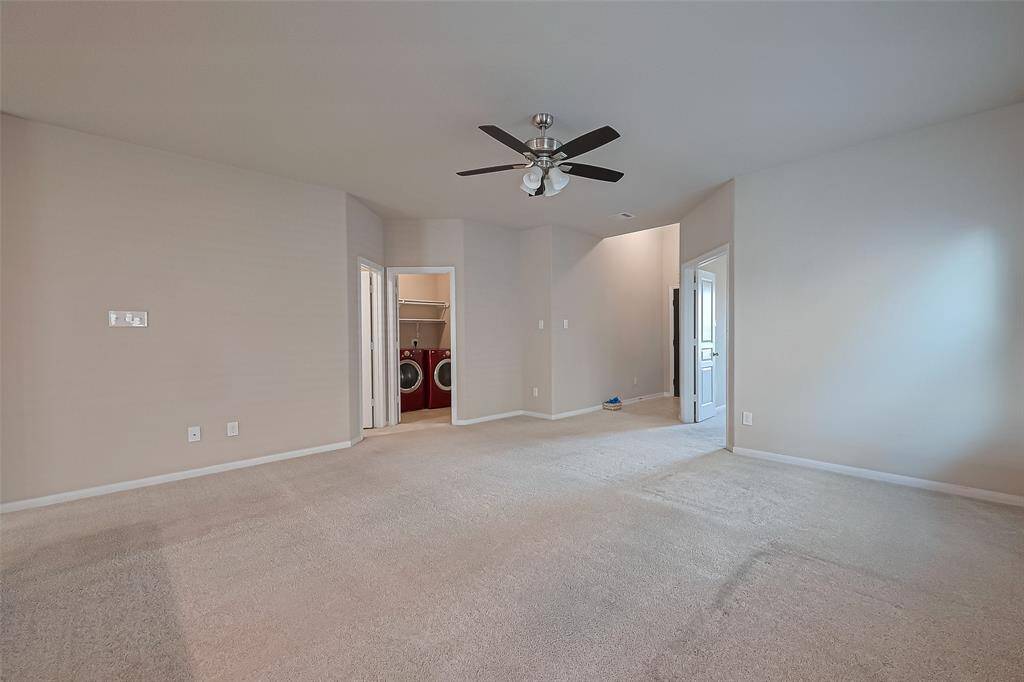 View of the living room to main entrance and double door officeLaundry connected to the garage door