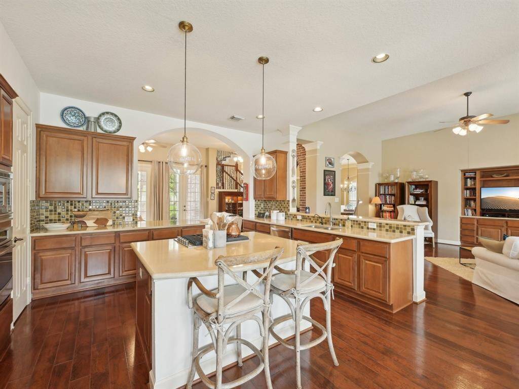 The island has breakfast bar seating, making it a great spot for a quick meal.