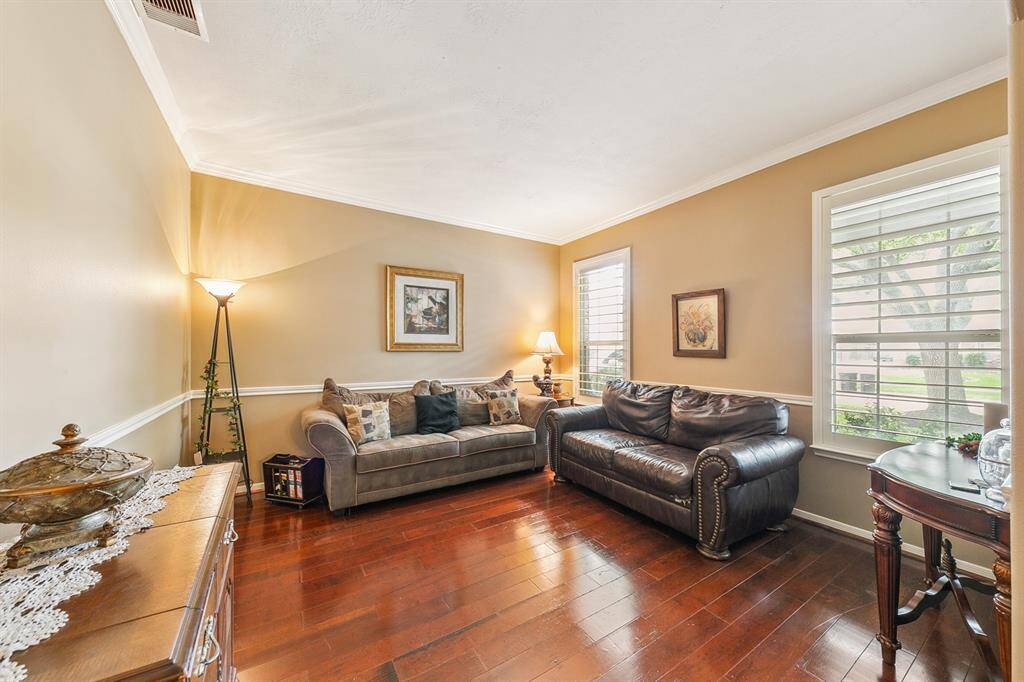 Sitting room off the entry way enjoys front yard views and can be utilized as a music room, study or overflow for entertaining guests.