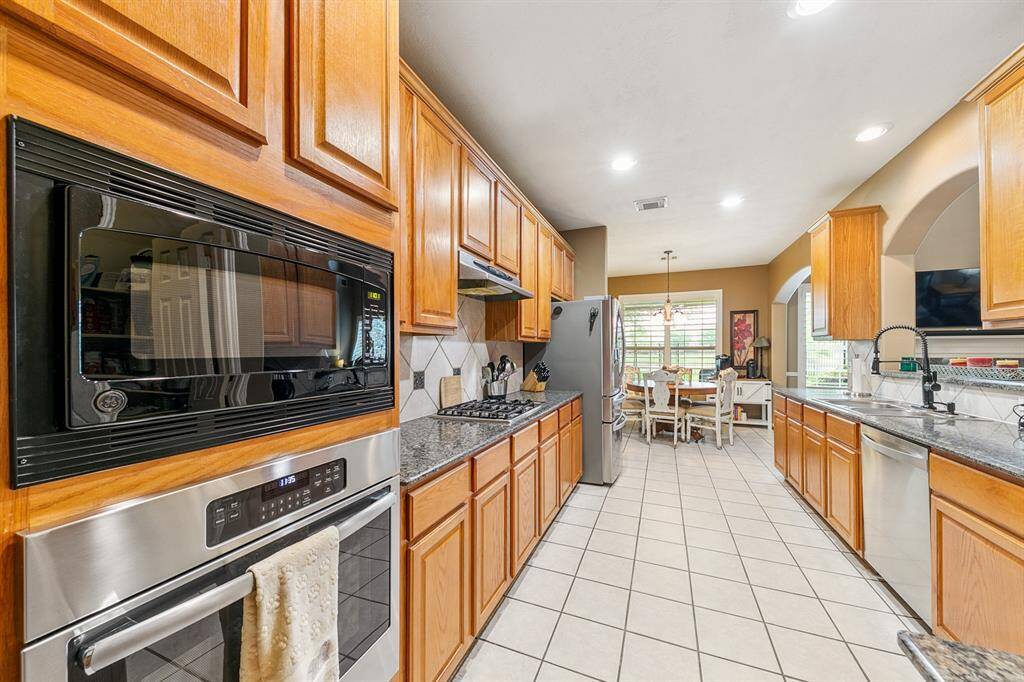 Amazing work horse kitchen with two walk-in pantries - one at each end!